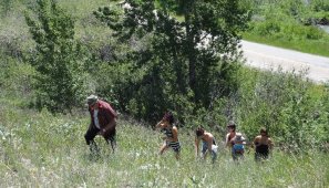Family line climbing the hill to visit mom - Montana