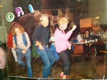 Mom in the 1990's - 2000s very far left dancing with dad and some random woman