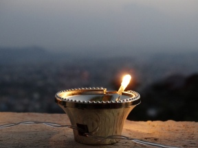 Electric candle with Kathmandu in background
